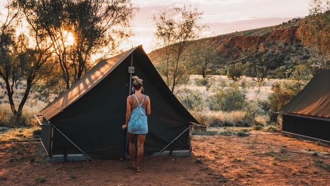 A visitor walking into her tent at Glen Helen Lodge in West MacDonnell National Park, located 161km west of Alice Springs.