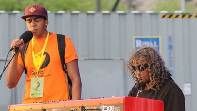 Woonun Edwin Willoughby (orange shirt) with father and internationally renowned indigenous musician, Bart Willoughby.