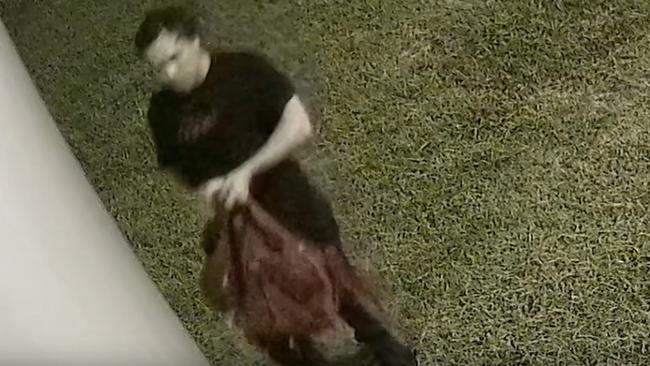 Police have released CCTV of a man they want to speak to in relation to an arson investigation of a mobile camera trailer in Mount Pleasant on January 20. Images: QPS