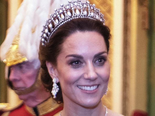 The Duchess of Cambridge talks to guests at an evening reception for members of the Diplomatic Corps at Buckingham Palace in London. PA Photo. Picture date: Wednesday December 11, 2019. See PA story ROYAL Queen. Photo credit should read: Victoria Jones/PA Wire.