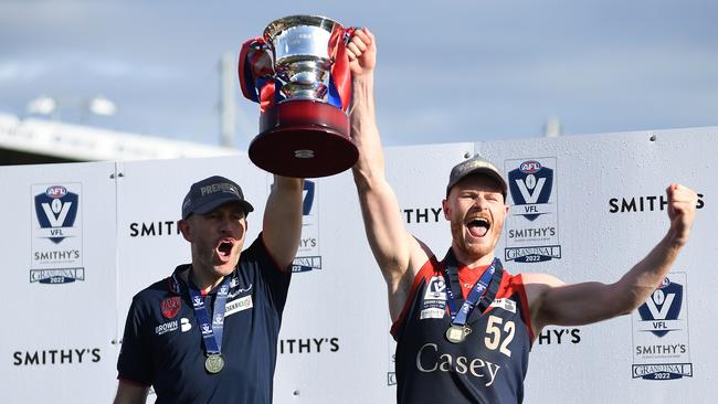 MELBOURNE, AUSTRALIA - SEPTEMBER 18: Mark Corrigan, coach of the Casey Demons and Mitch White of the Casey Demons celebrate after the 2022 VFL Grand Final match between the Casey Demons and the Southport Sharks at Ikon Park on September 18, 2022 in Melbourne, Australia. (Photo by Felicity Elliott/AFL Photos via Getty Images)