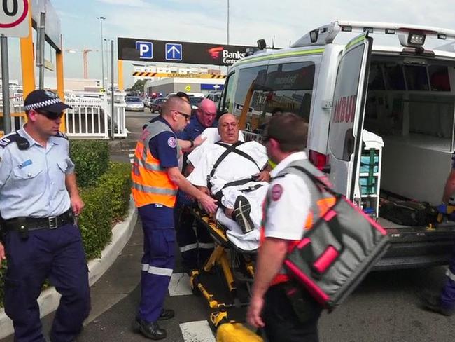 One of the victims of the Bankstown Centro Shopping Centre shooting being loaded into an ambulance. Picture: Channel 10 / Twitter