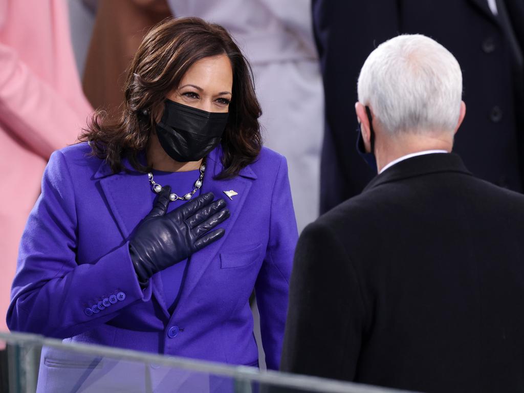 Kamala Harris greets Mike Pence as they prepare to pass the vice-presidential baton. Picture: Alex Wong/Getty Images