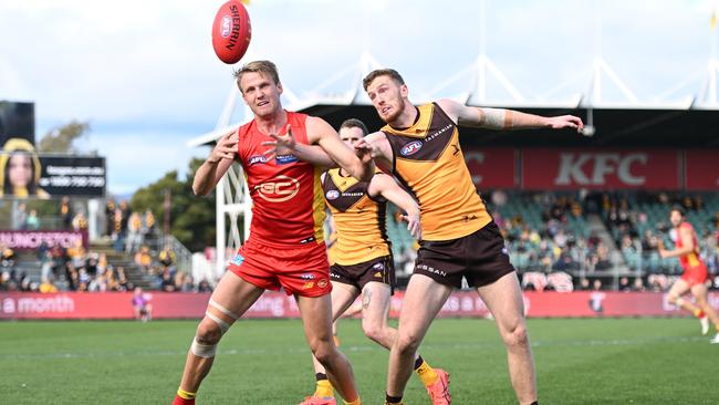 Jack Lukosius and Denver Grainger-Barras compete for the ball in the Hawthorn-Gold Coast clash in Launceston last week. Picture: Steve Bell/Getty Images