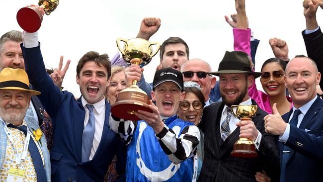 Mark Zahra and Gold Trip’s trainers celebrate their win on Tuesday. Picture: AFP