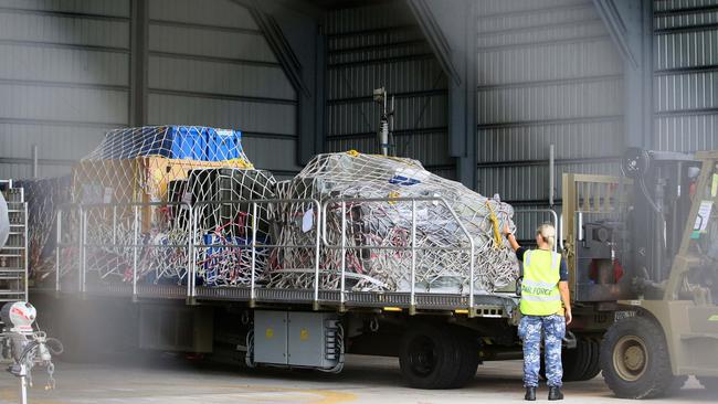 An RAAF plane delivers equipment to Christmas Island detention centre. Picture: Colin Murty