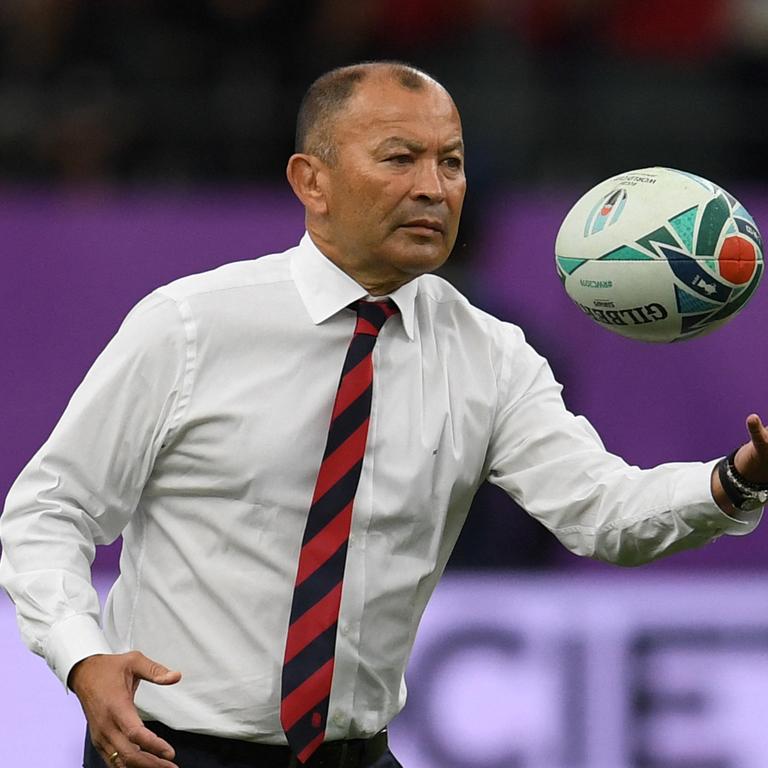 Eddie Jones juggles a ball before a World Cup match.