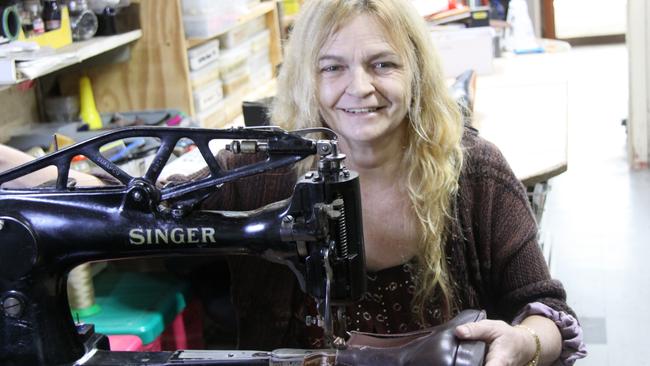 For 67 years Theo's Shoe Hospital has been the go-to for Cairns residents needing quality shoes, bags and luggage repairs. Cobblers Monica and Mick McLeod said they love to restore worn items to their former glory. Picture: Alison Paterson