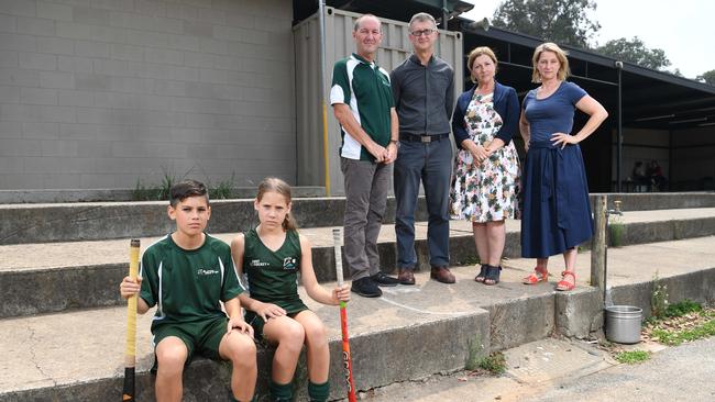 Hockey club members Callum and Piper with club president Greg Purser, Cr Grant Brooker, Yan Yean MP Danielle Green and Eltham MP Vicki Ward outside the dilapidated sports pavilion. Photo: Julian Smith