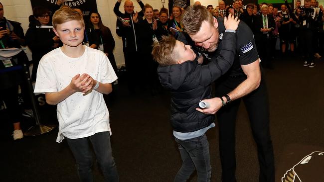 Nathan Buckley with his sons Jett and Ayce after Collingwood’s win. Picture: Michael Wilson AFL Media