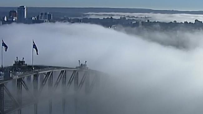 Heavy fog obscures the Sydney Harbour Bridge on Monday morning. Picture: Channel 9