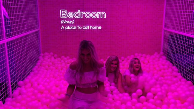 Bachelor contestants (from left) Charley Bond, Gemma White and Steph Harper enjoy The Bedroom Lounge Bar ball pit at the venue relaunch on Friday night. Photo: Ryan Keen.