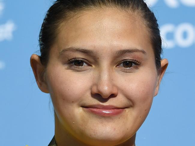 Melissa Wu of Australia looks on during the medal ceremony after winning the Womens 10m Platform Final on day two of diving competition at the XXI Commonwealth Games at the Gold Coast Aquatic Centre on the Gold Coast, Australia, Thursday, April 12, 2018. (AAP Image/Dave Hunt) NO ARCHIVING, EDITORIAL USE ONLY