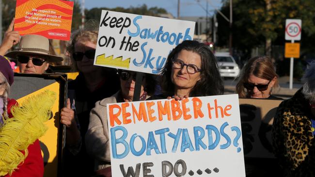 People rally against the demolition of the historic sawtooth Shed 26 in Port Adelaide. Picture: AAP / Kelly Barnes