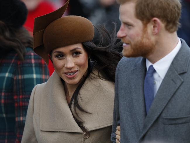 (FILES)  (L-R) US actress and fiancee of Britain's Prince Harry Meghan Markle and Britain's Prince Harry arrive to attend the Royal Family's traditional Christmas Day church service at St Mary Magdalene Church in Sandringham, Norfolk, eastern England, on December 25, 2017. (Photo by Adrian DENNIS / AFP)