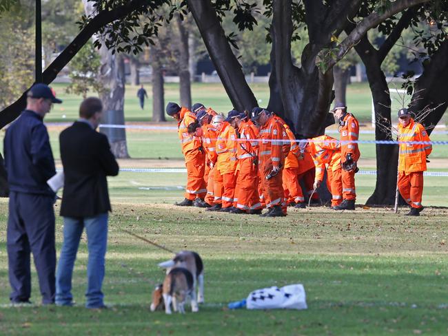 Police at the scene in Fawkner park. Picture: David Crosling