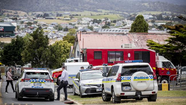 Police and fire investigators at the site of the overnight fire at Cosgrove High School. Picture: RICHARD JUPE