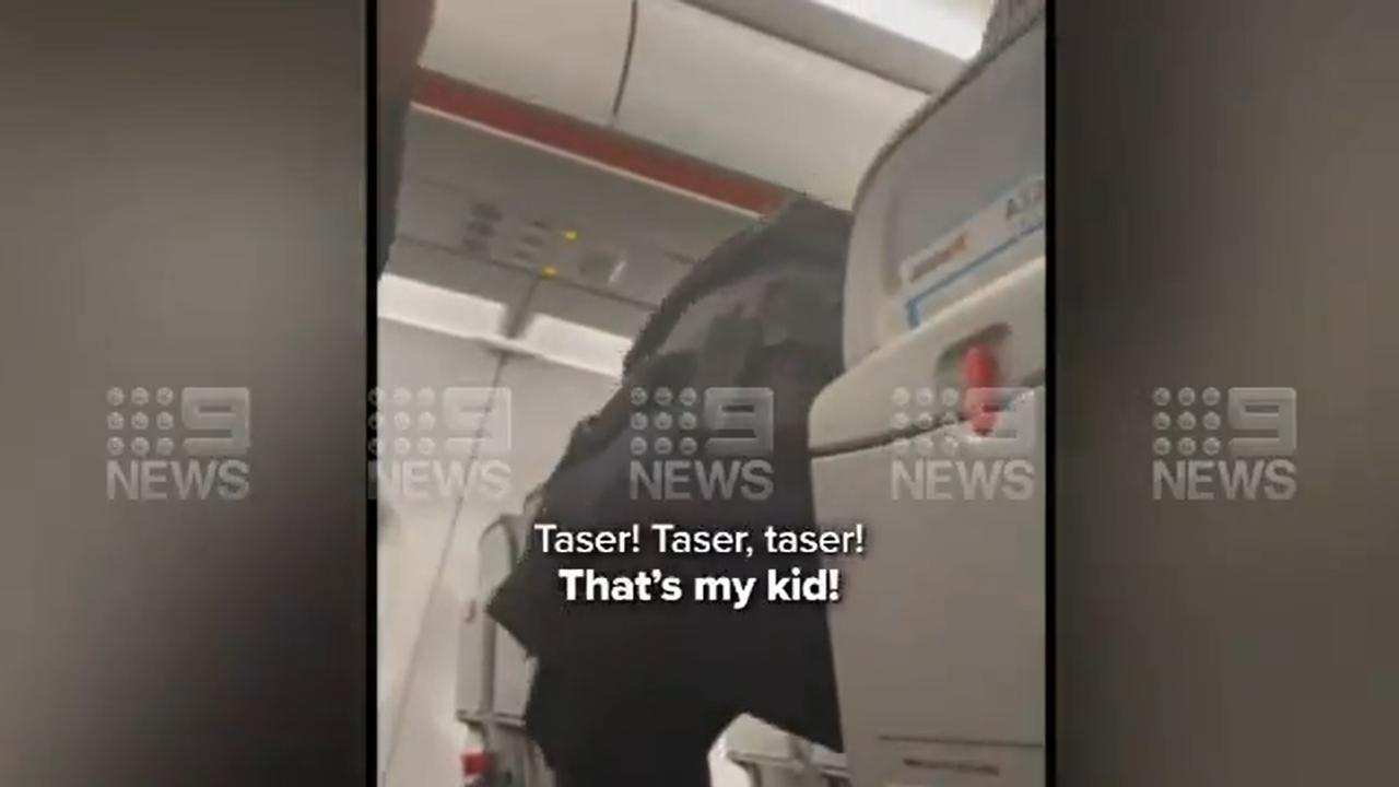 Video shows AFP officers tapering Mr Malou. Picture: Nine News