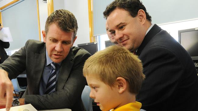 NSW Premier Mike Baird visits Kingswood South Public School. He is pictured with the Member for Penrith, Stuart Ayres and Kindergarten student Alex Vale, 5.