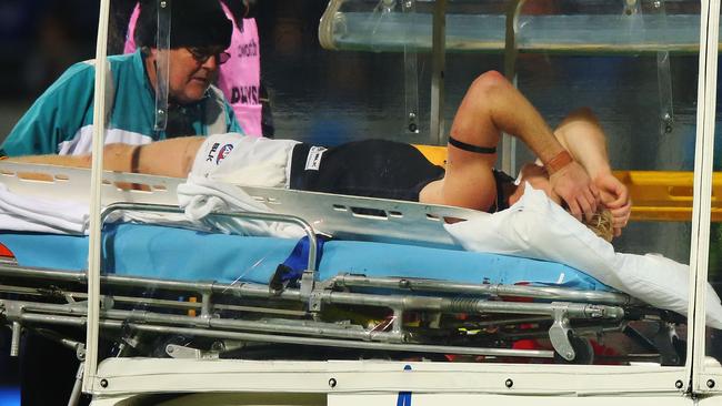 Steven Morris is stretchered off the ground. Picture: Getty Images