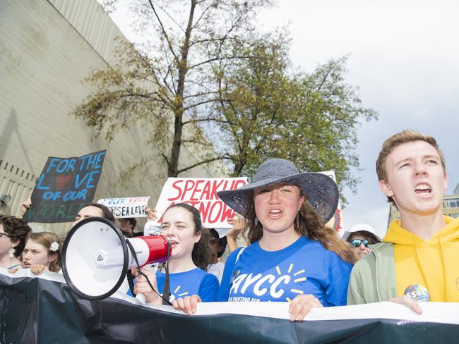 Bryher Mckewin (with mic) , Amelie Hudspeth and Toby Thorpe. Climate strike rally in Hobart. Picture: RICHARD JUPE