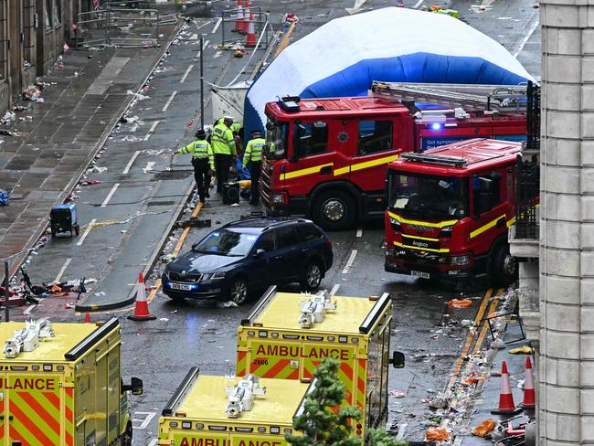 The car that ploughed into the crowd, surrounded by emergency service vehicles. Picture: Paul Ellis/AFP