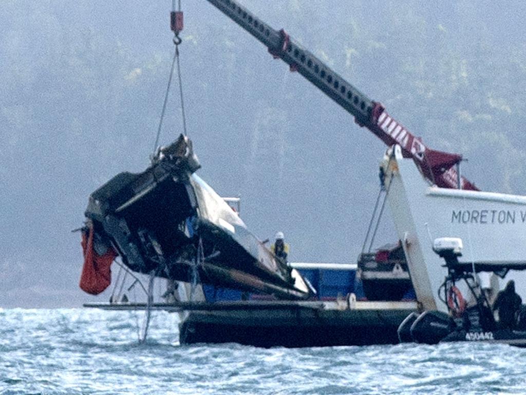 #NO AUSTRALIAN, NO NEWSWIRE NO ONSALE # A barge anchored at the site where a MRH 90 Taipan military helicopter crashed, lifts out the tail section. in the Whitsundays while carrying four Australians -Saturday 29 July 2023 Picture: Michaela Harlow