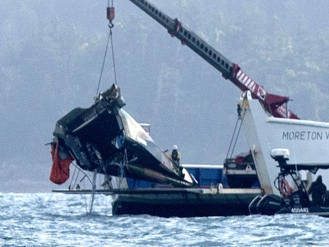 #NO AUSTRALIAN, NO NEWSWIRE NO ONSALE # A barge anchored at the site where a MRH 90 Taipan military helicopter crashed, lifts out the tail section. in the Whitsundays while carrying four Australians -Saturday 29 July 2023 Picture: Michaela Harlow