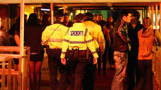 Tasmania Police patrol the salamanca area on a Friday evening