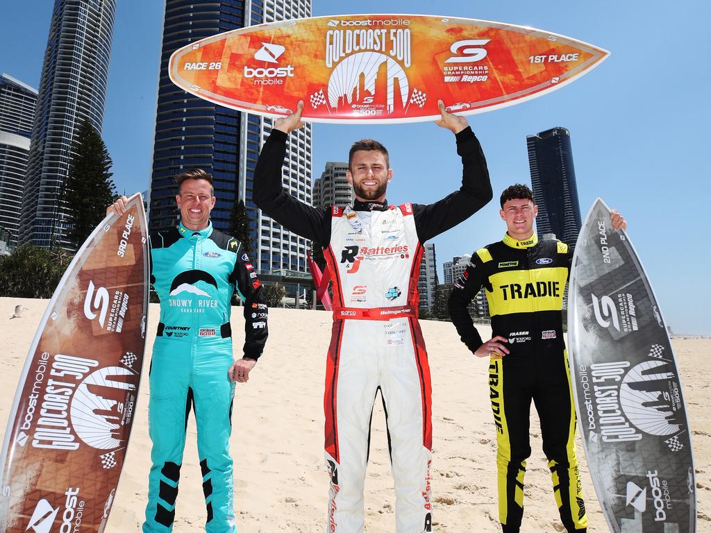 James Courtney with fellow drivers Andre Heimgartner and Declan Fraser, show off the 2023 Boost Mobile GC500 trophies four days before their cars hit the racetrack. Picture Glenn Hampson