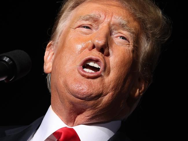 CULLMAN, ALABAMA - AUGUST 21: Former U.S. President Donald Trump addresses supporters during a "Save America" rally at York Family Farms on August 21, 2021 in Cullman, Alabama. With the number of coronavirus cases rising rapidly and no more ICU beds available in Alabama, the host city of Cullman declared a COVID-19-related state of emergency two days before the Trump rally. According to the Alabama Department of Public Health, 67.5% of the state's population has not been fully vaccinated.   Chip Somodevilla/Getty Images/AFP == FOR NEWSPAPERS, INTERNET, TELCOS & TELEVISION USE ONLY ==