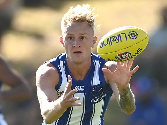 MELBOURNE, AUSTRALIA - MARCH 06: Jaidyn Stephenson of the Kangaroos marks during the AFL Community Series match between the Hawthorn Hawks and the North Melbourne Kangaroos at Arden Street Ground on March 06, 2021 in Melbourne, Australia. (Photo by Quinn Rooney/Getty Images)