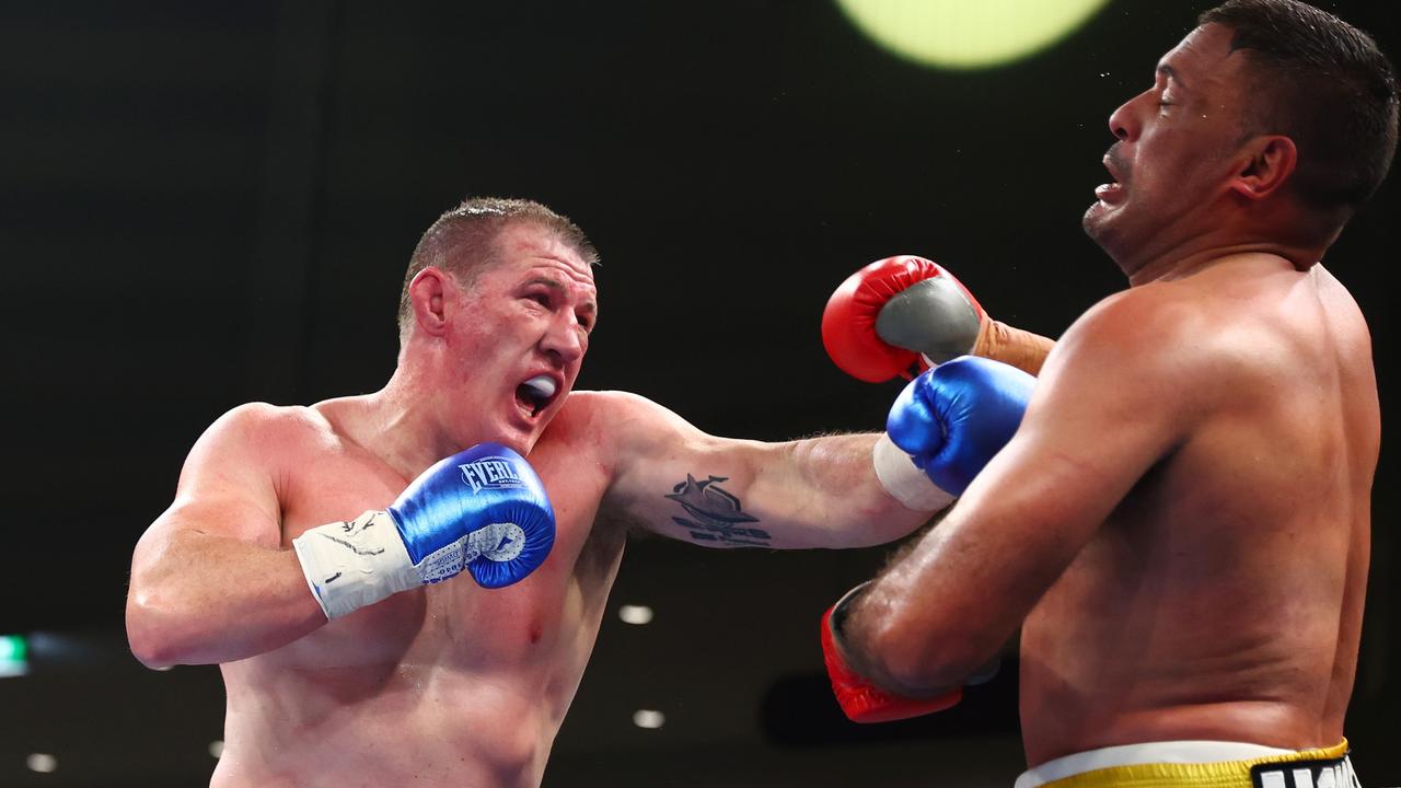 Paul Gallen punches Justin Hodges their most recent bout which Gallen won by TKO in the third round.