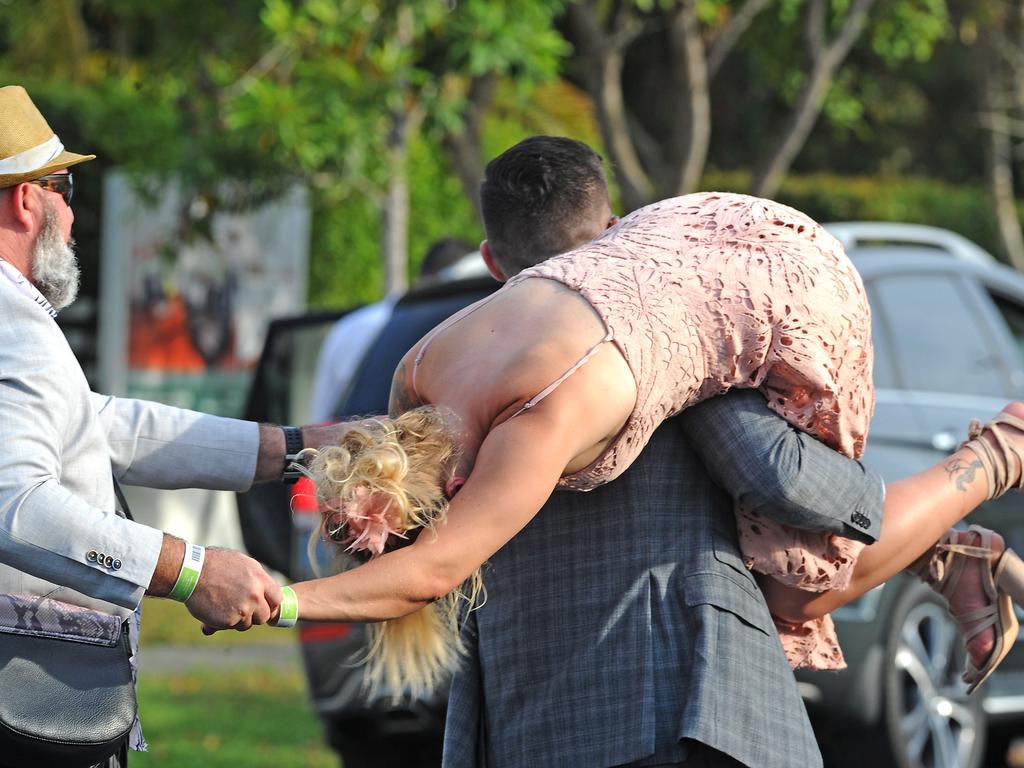 It’s been a big day for this woman at Doomben in Brisbane. Picture: AAP/John Gass