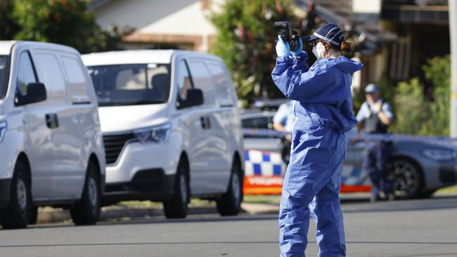 Forensics and police at a crime scene at a house on Layton St in Wentworthville. Picture: Damian Shaw