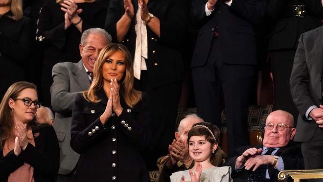 Melania Trump (2nd L) applauds special guest Grace Eline (2nd R). Picture: AFP.