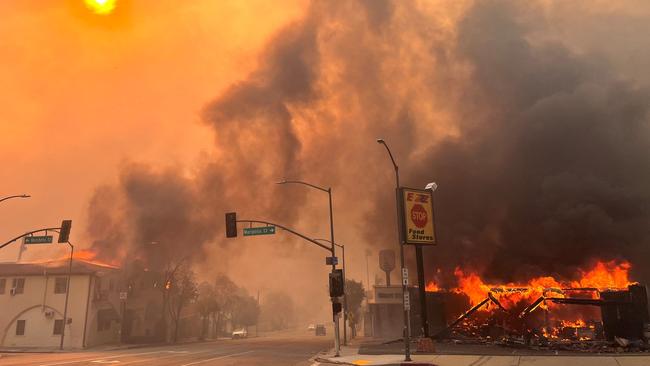 Flames from the wind-driven Eaton Fire engulf a house at Altadena. Picture: AFP