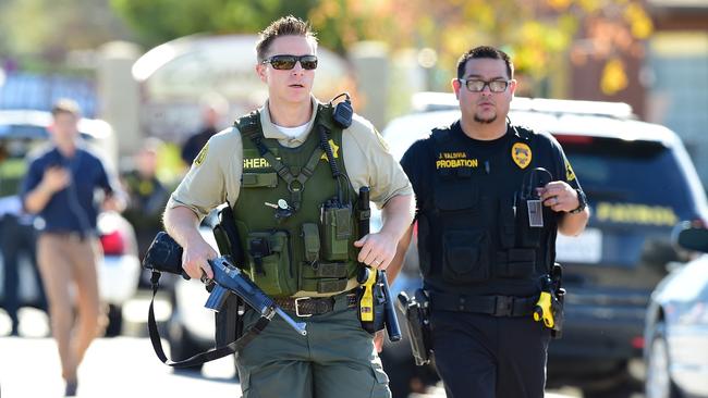 Centre for disabled targeted ... police at the scene of the  shooting in San Bernardino, California.