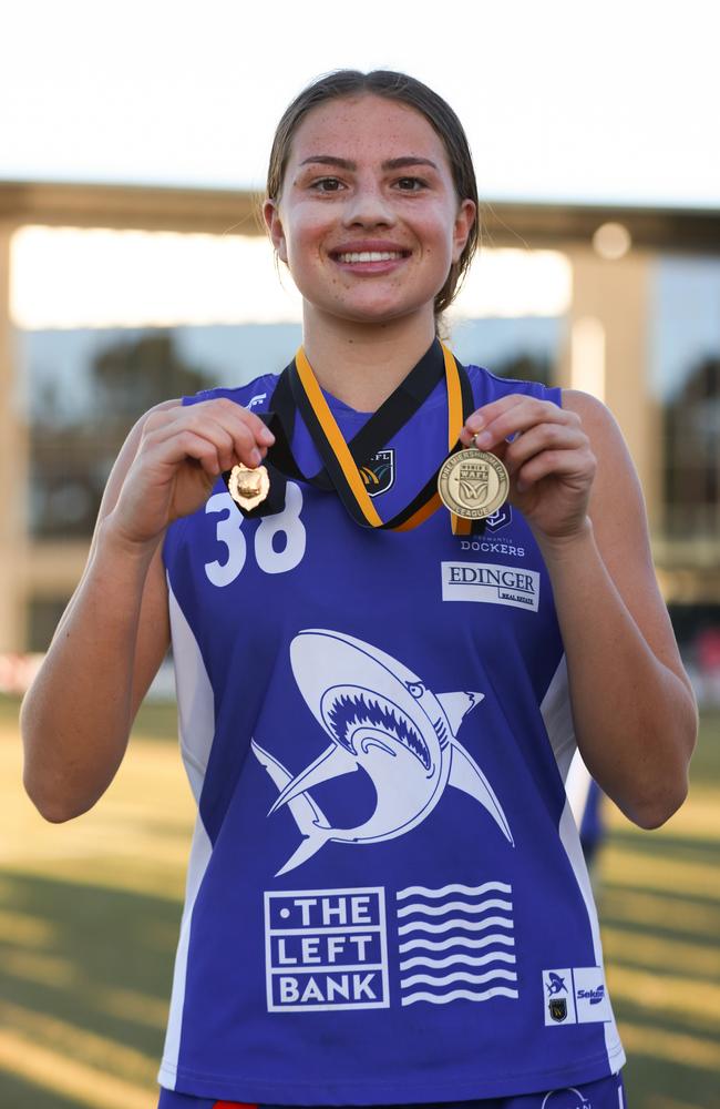 Zippy Fish shows off her 2023 premiership and best on ground medals during the Sharks’ 2023 premiership. Picture: James Worsfold/Getty Images.