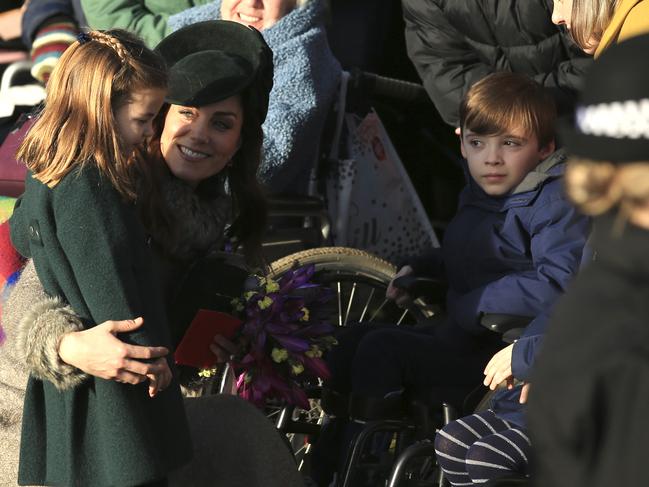 Princess Charlotte meets an admirer. Picture: AP