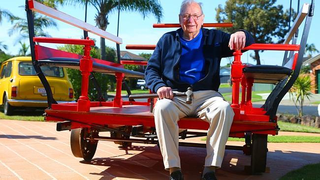 Stan Goodman, 94, is an electrician by trade but has been building old-fashioned train track inspection vehicles. Picture: Phil Rogers