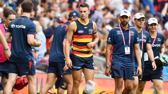 Tom Doedee after he ruptured his ACL against Hawthorn. Picture: AAP Image/David Mariuz