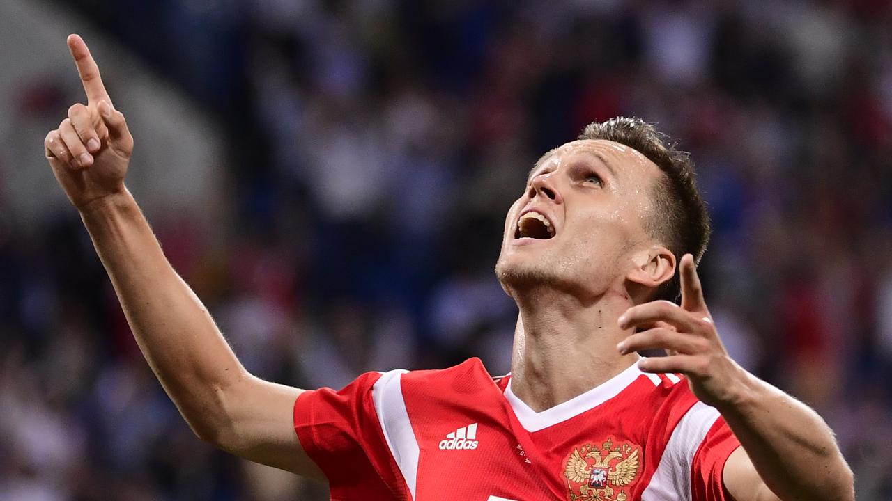 Russia's midfielder Denis Cheryshev celebrates after scoring a goal