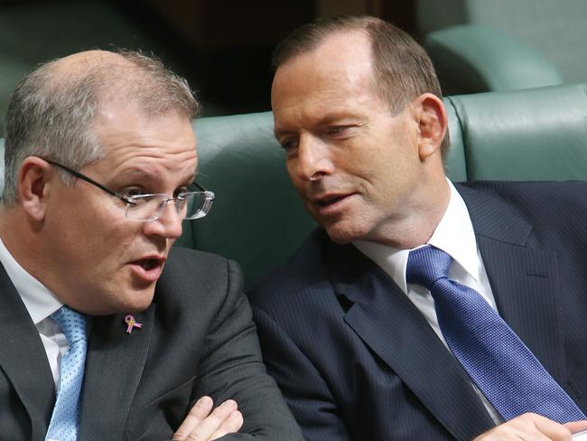 The door is closed to people from Ebola affected countries. Scott Morrison with Prime Minister Tony Abbott in Parliament yesterday. Picture: Gary Ramage