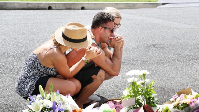 Mourners at the Camp Hill murder scene pay their respects to Hannah Clarke, Aaliyah, Laianah and Trey. Photographer: Liam Kidston