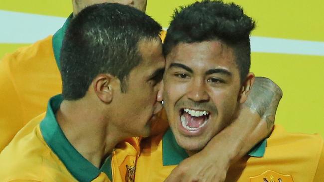 MELBOURNE, AUSTRALIA - JANUARY 09: Massimo Luongo of the Socceroos is congratulated by Tim Cahill and his teammates after scoring a goal during the 2015 Asian Cup match between the Australian Socceroos and Kuwait at AAMI Park on January 9, 2015 in Melbourne, Australia. (Photo by Scott Barbour/Getty Images)