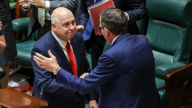 Victorian Treasurer Tim Pallas is congratulated by Premier Dan Andrews after delivering the budget in Parliament House. Picture: Ian Currie