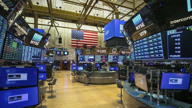 This photo provided by the New York Stock Exchange shows the unoccupied NYSE trading floor, closed temporarily for the first time in 228 years as a result of coronavirus concerns. Picture: AP