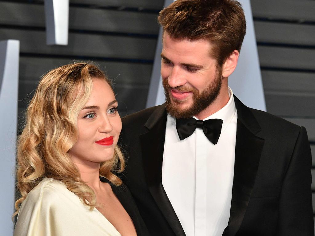 Miley Cyrus (L) and Liam Hemsworth in happier times. Picture: AFP