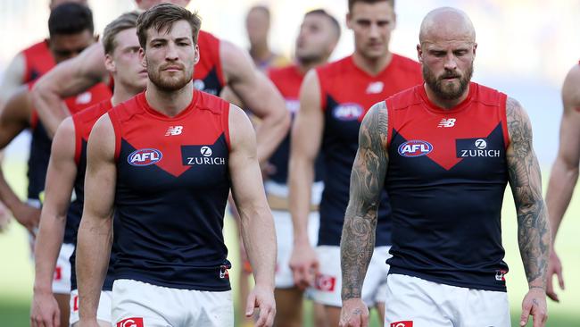 Nathan Jones and Jack Viney lead the Demons off. Picture: Michael Klein